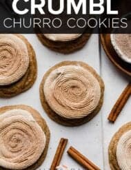 Copycat Crumbl Churro Cookies topped with frosting and cinnamon sugar on a white plate.