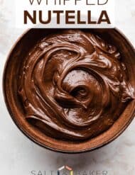 A bowl of whipped Nutella on a white background.