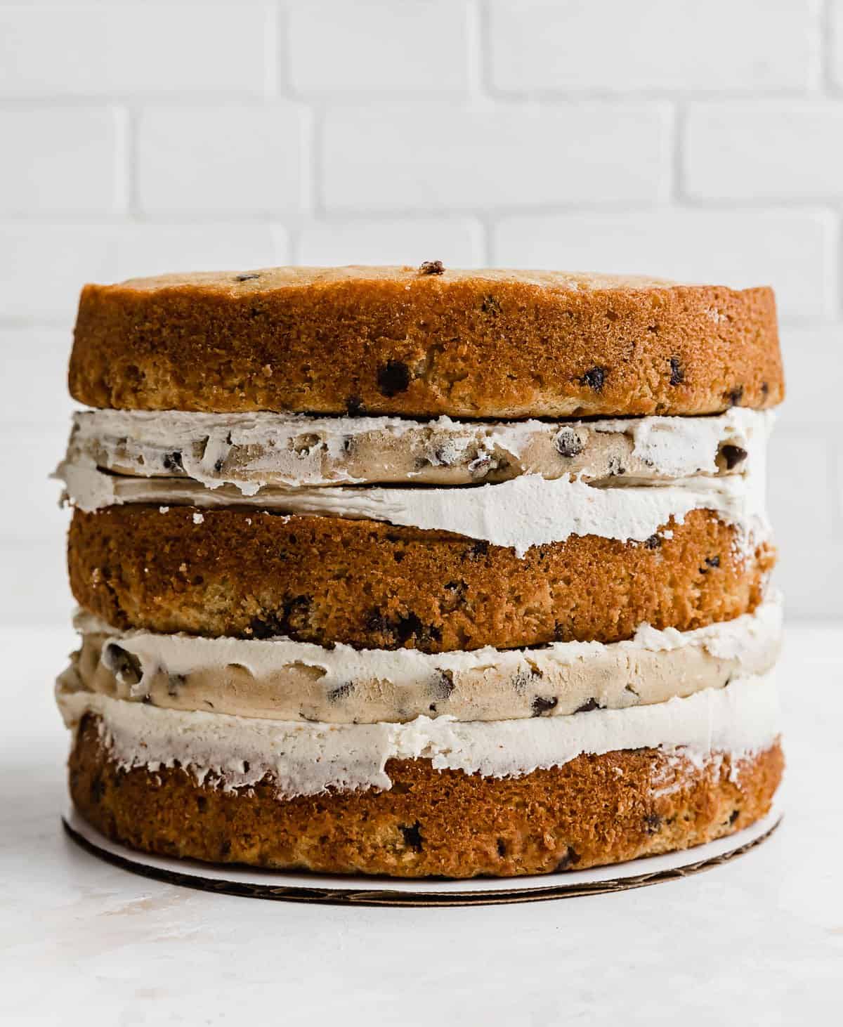 A three tier brown butter Cookie Dough Cake that hasn't been frosted.
