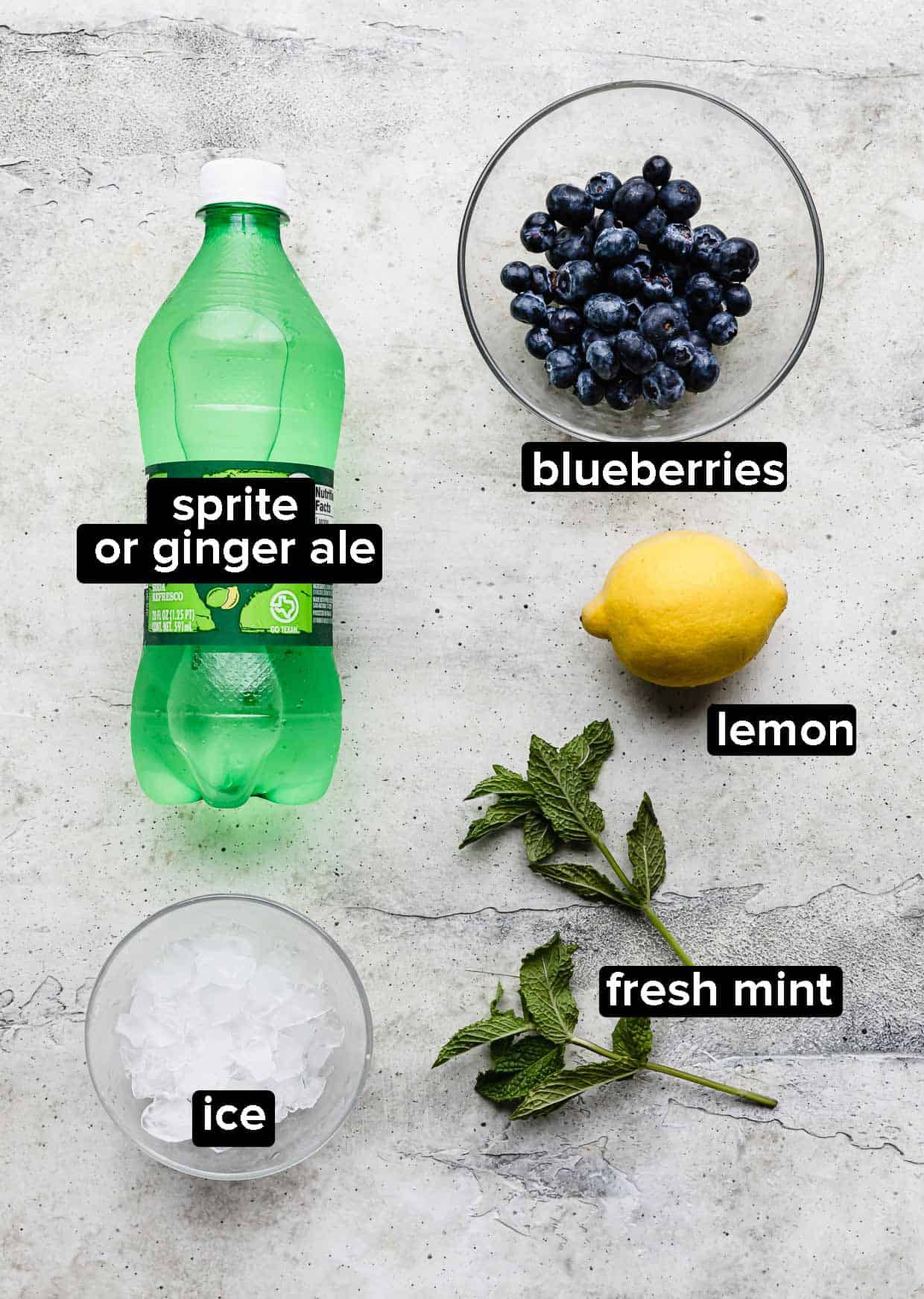 Ingredients used to make a blueberry mocktail with sprite or ginger ale.