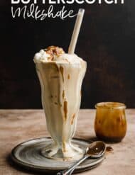 A Butterscotch Milkshake in a glass jar against a black background with the words "Butterscotch Milkshake" written in white text over the image.