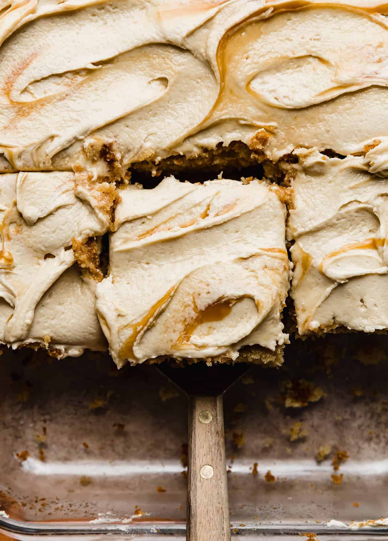 Overhead photo of Butterscotch frosting swirled on a brown butter butterscotch cake.
