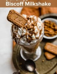 A lotus milkshake with the words "the best Biscoff Milkshake" in white text over the photo.