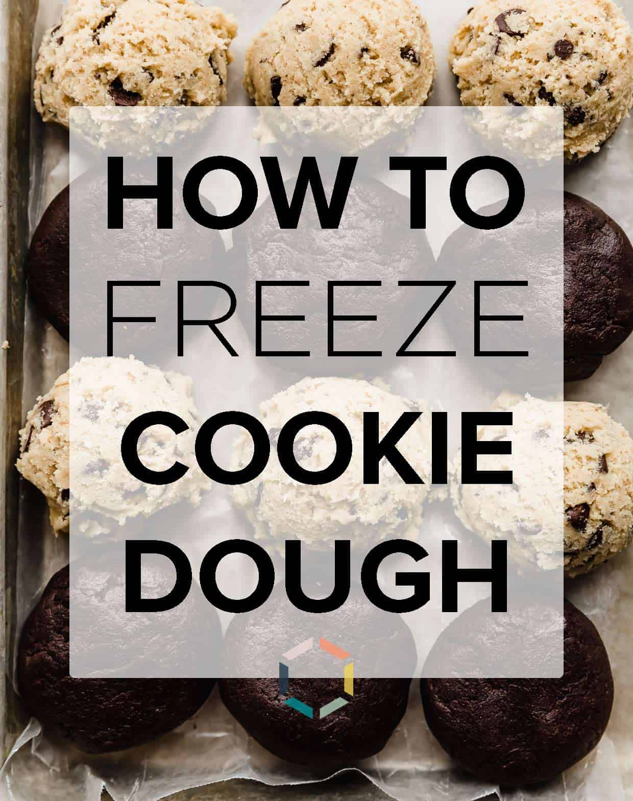 Cookie dough balls lined up on a baking sheet with the words "how to freeze cookie dough" in black text over the photo.