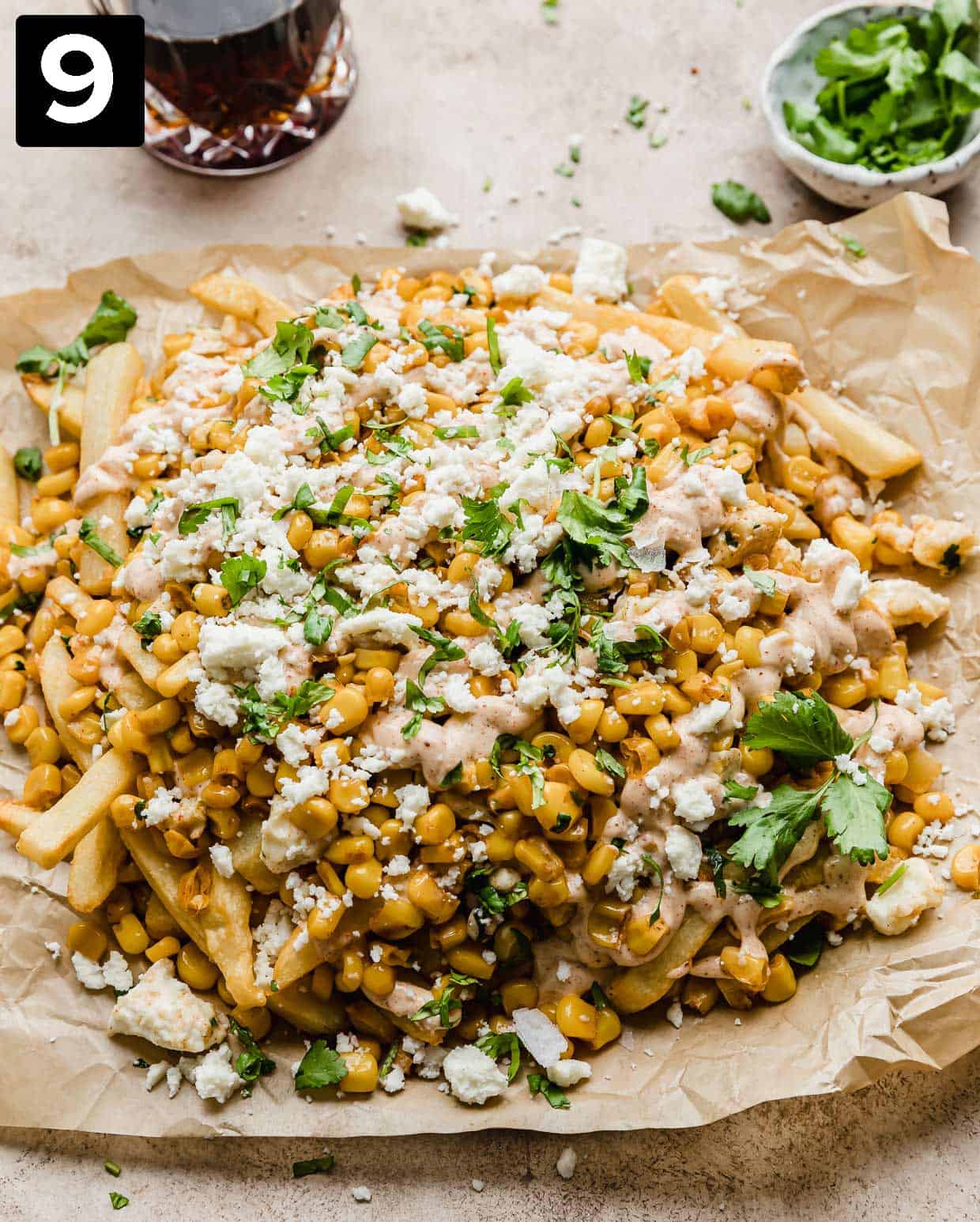 Corn Fries topped with a Mexican Street Corn Crema, cilantro, and cheese.