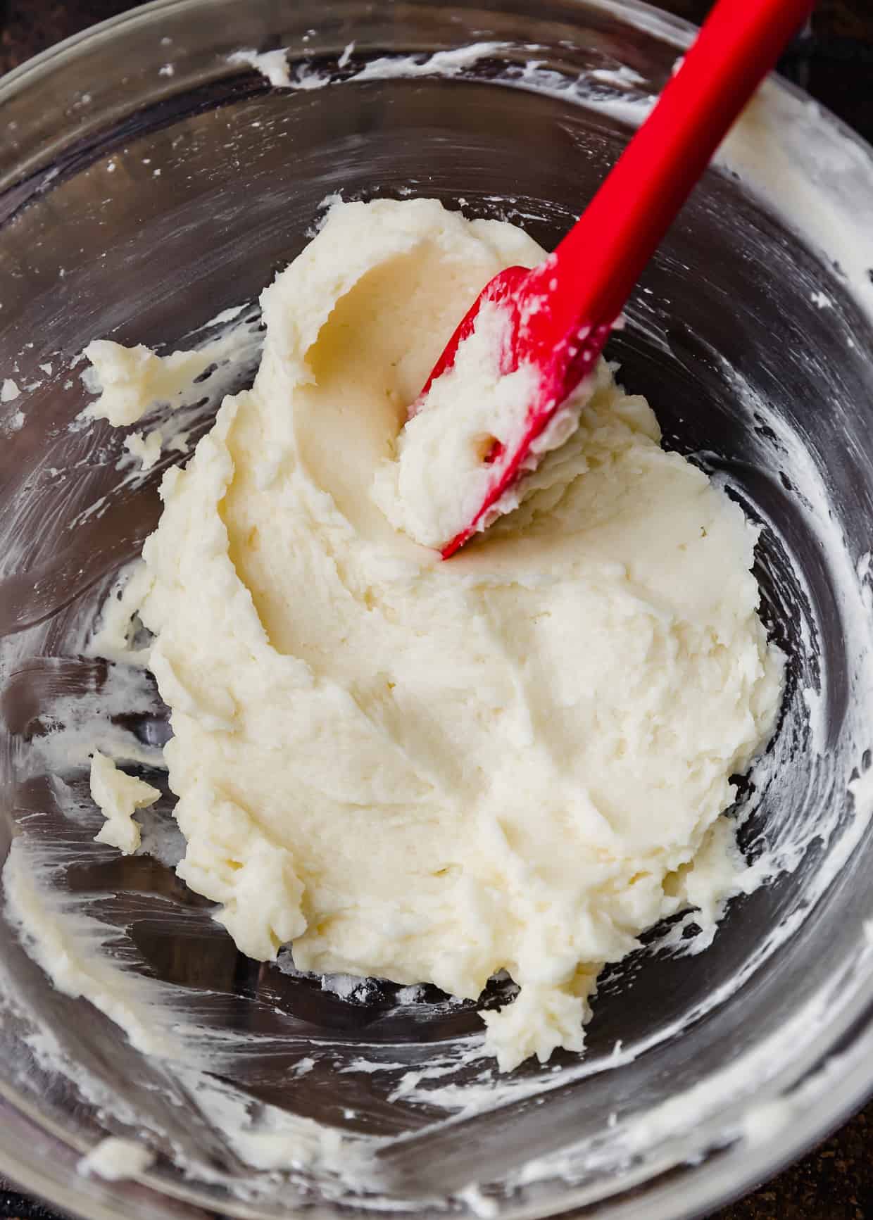 A glass bowl filled with whipped butter.