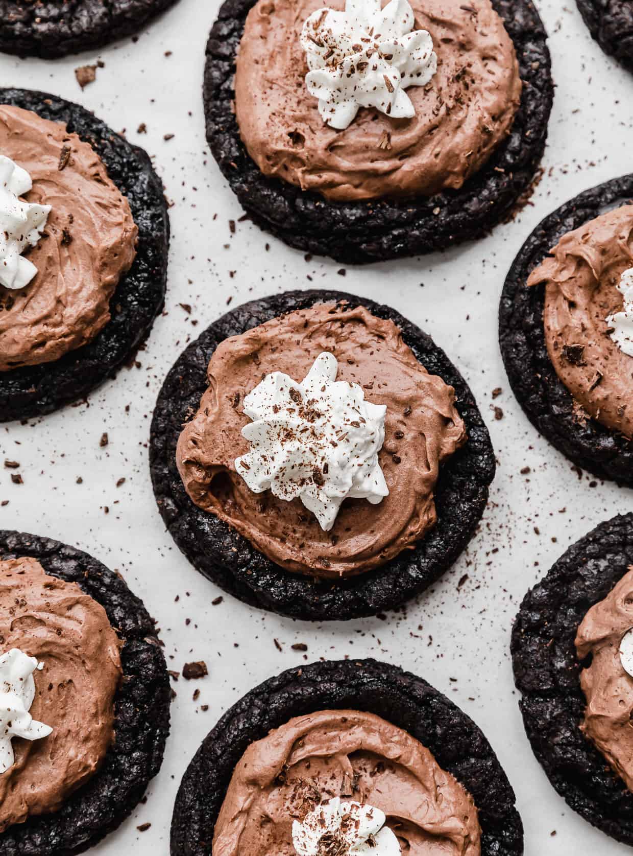 French Silk Pie Cookies: Oreo cookie base topped with chocolate mousse, whipped cream, and chocolate shavings.