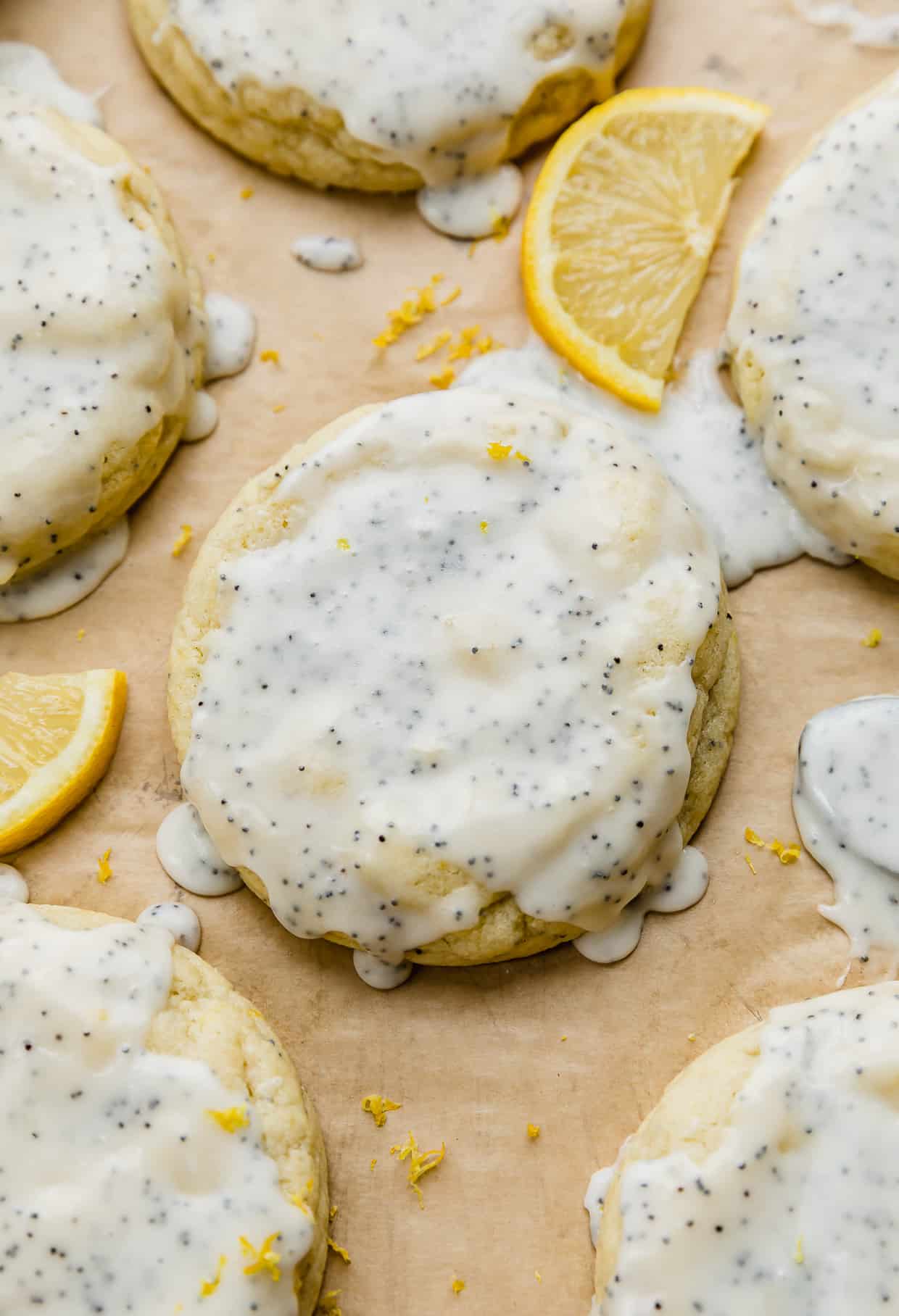 Lemon Poppy Seed Cookies on tan parchment paper.