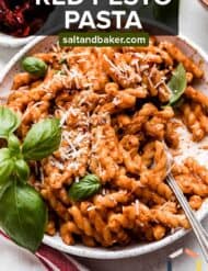 A bowl of Red Pesto Pasta with the words "Red Pesto Pasta" written in white text over the photo.