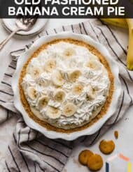 An overhead photo of a Banana Cream Pie in a white ruffled pie plate with the words, "Old fashioned banana cream pie" written in white text over the photo.