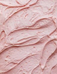 Swirled pink buttercream frosting.