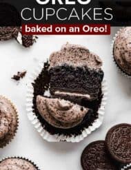 An Oreo Cupcake cut in half with the words, "Oreo Cupcakes baked on an oreo" in white text over the photo.