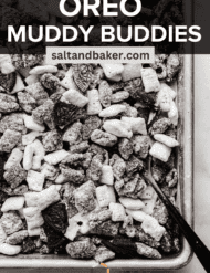 Black and white covered Chex cereal on a baking sheet with the words, "Oreo Muddy Buddies" written in white text over the photo.