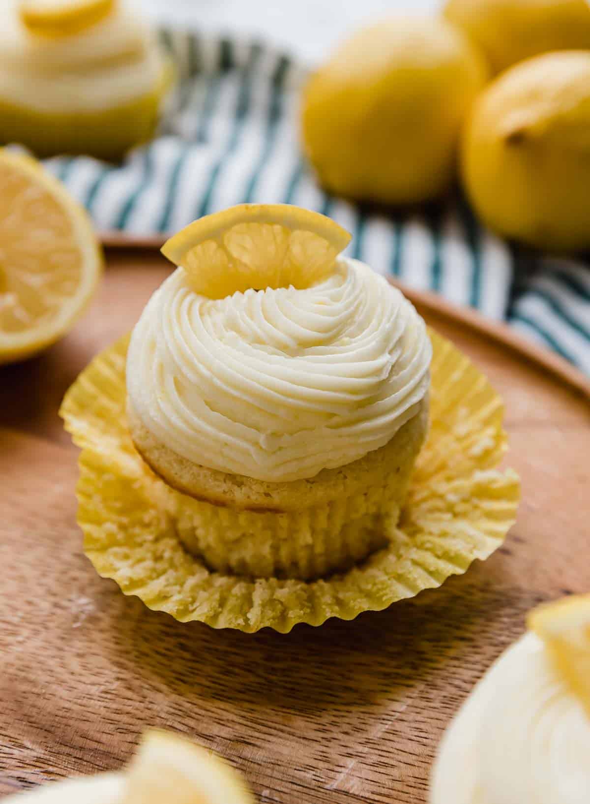 Lemon Cupcake on a wood plate.