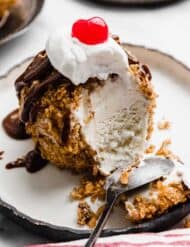 Fried Ice Cream with a spoon scooping through the ice cream ball.
