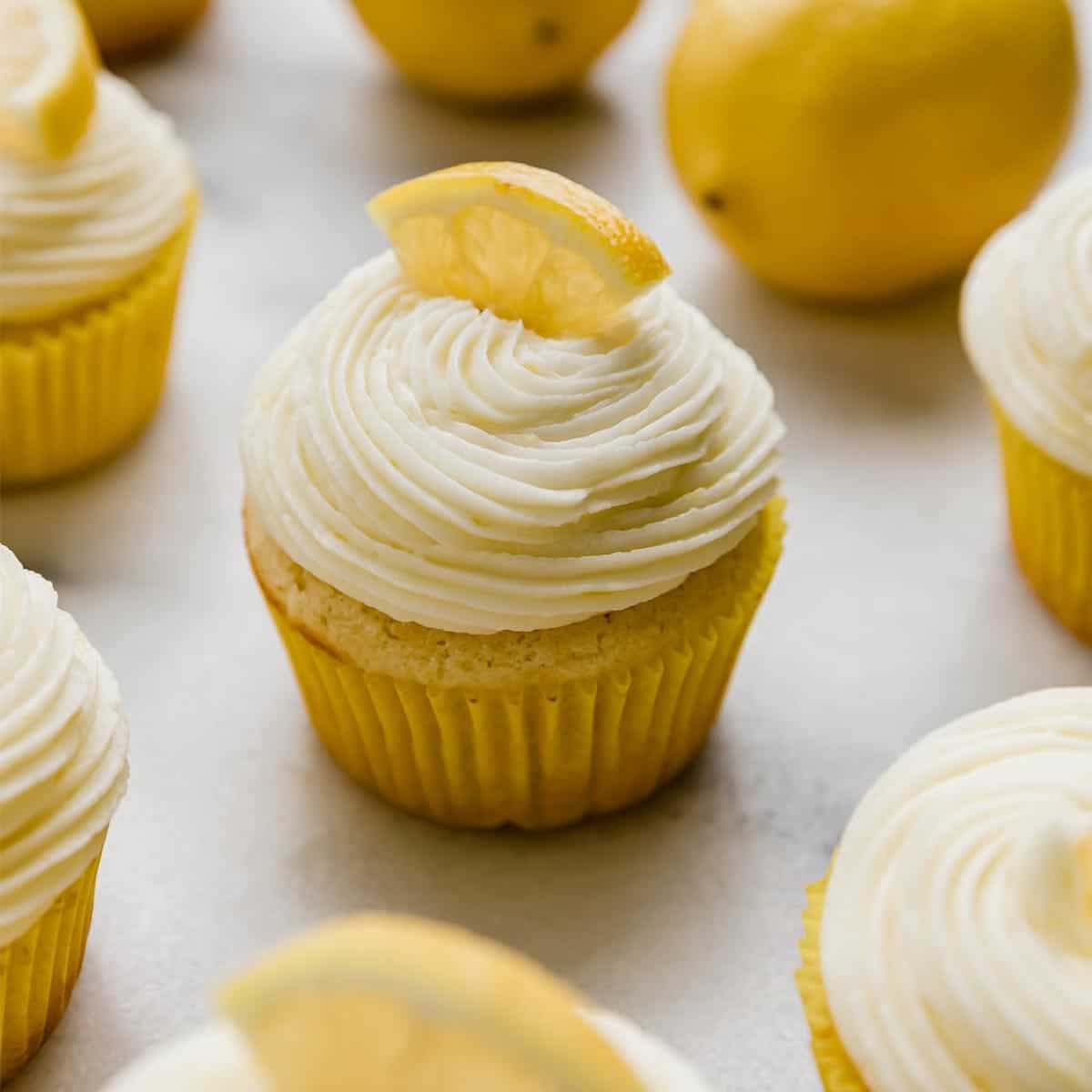 A lemon cupcake topped with a swirl of Lemon Buttercream.