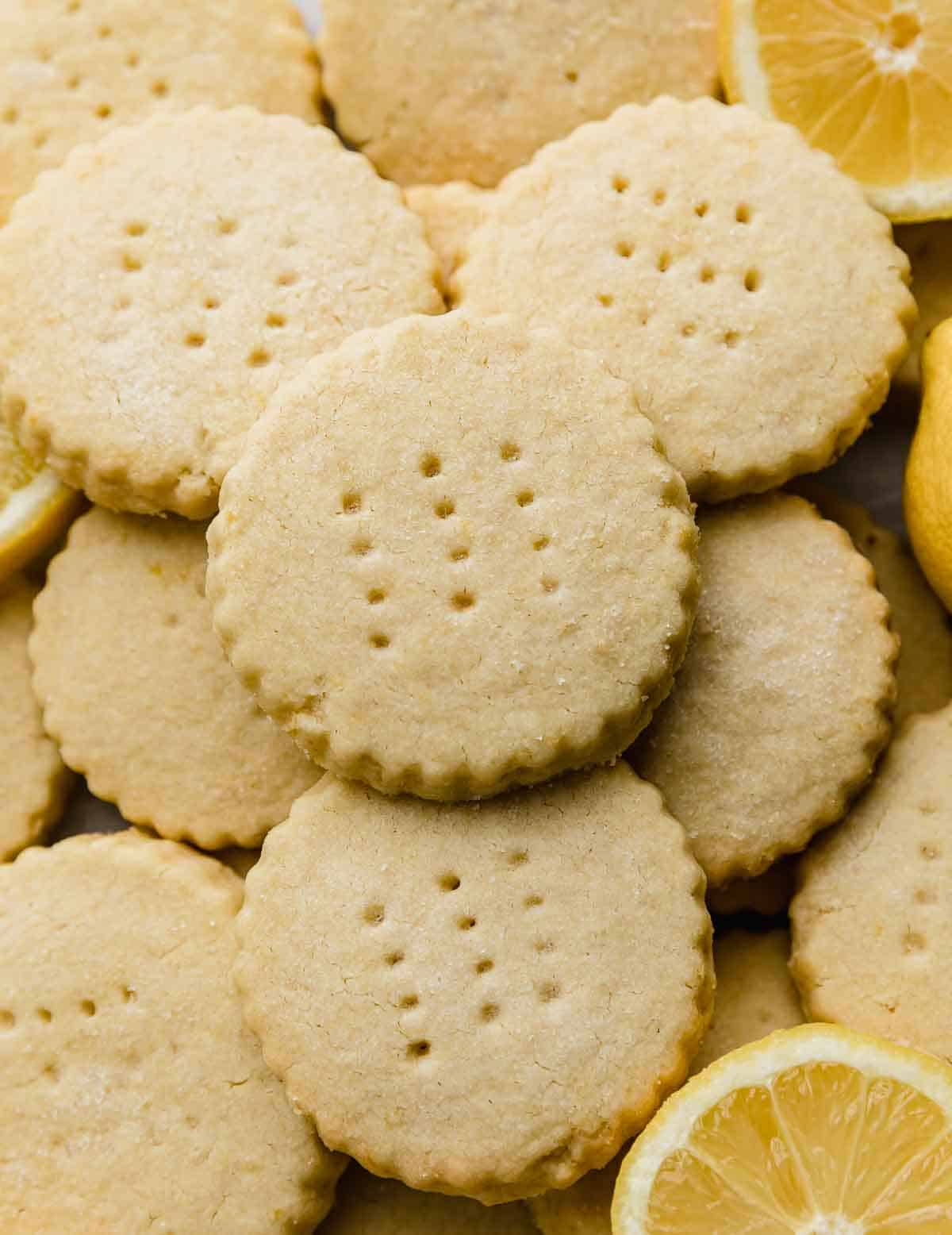 Round Lemon Shortbread Cookies with fork tine piercings on the tops of each cookie.