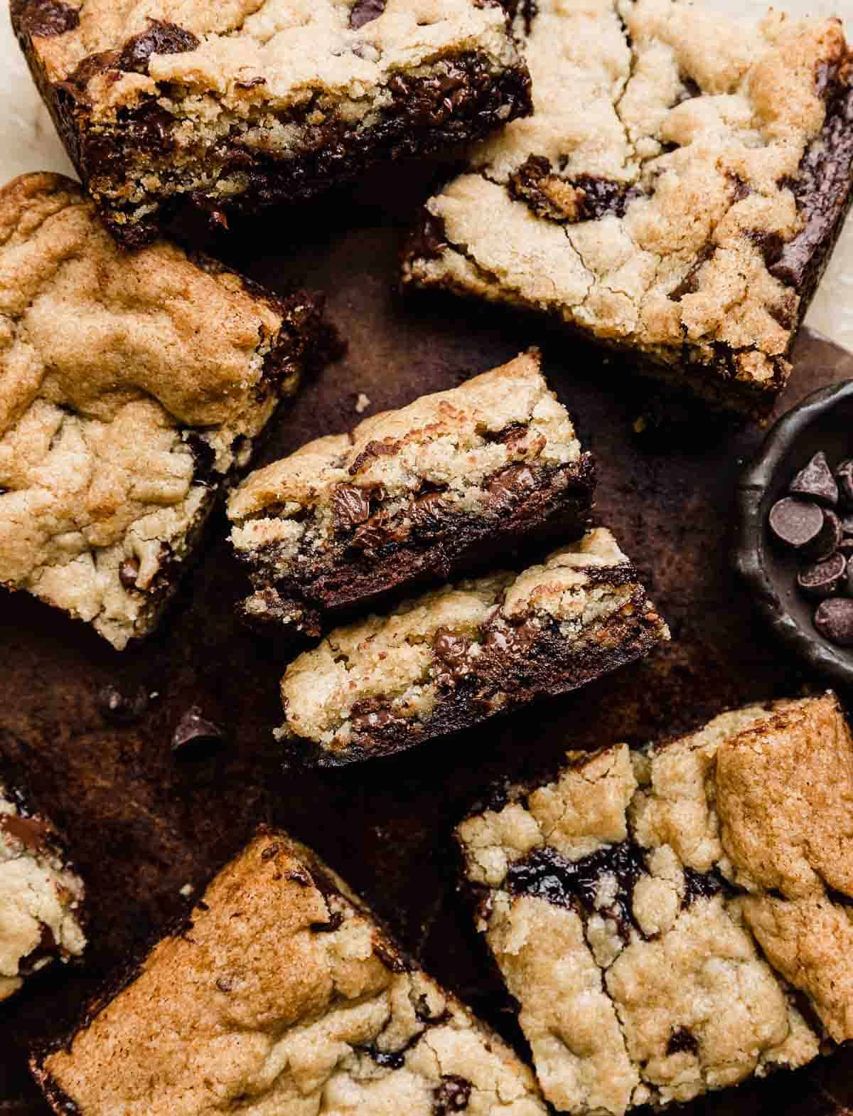 Brownie cookie bars on a brown background.