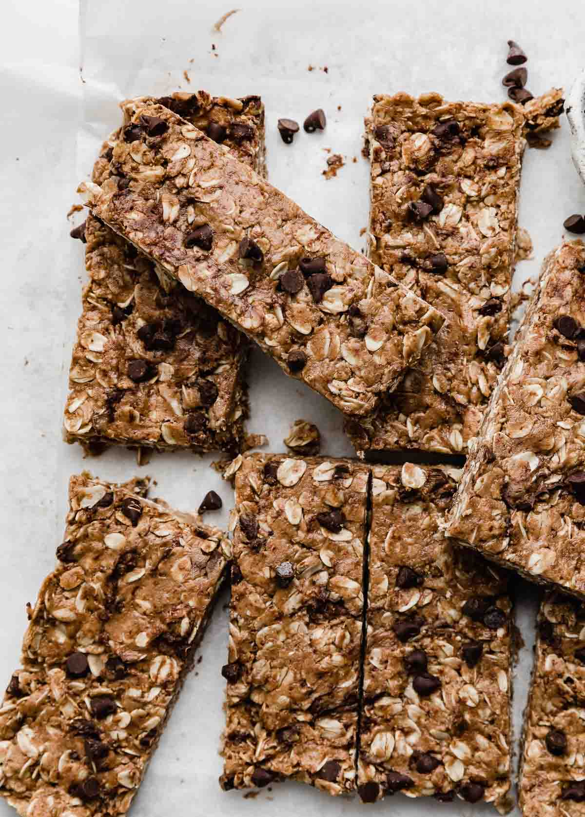 Chocolate Peanut Butter Protein Bars on a white parchment paper.