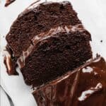 Slices of Chocolate Pound Cake on a white background.