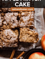 Apple Fritter Cake made with real diced apples and topped with icing, on a white parchment paper with the words, "Apple Fritter Cake" written in white text above the photo.