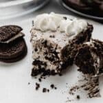 Slice of Oreo pie, Cookies and Cream Pie, with a bite taken out of the pie.