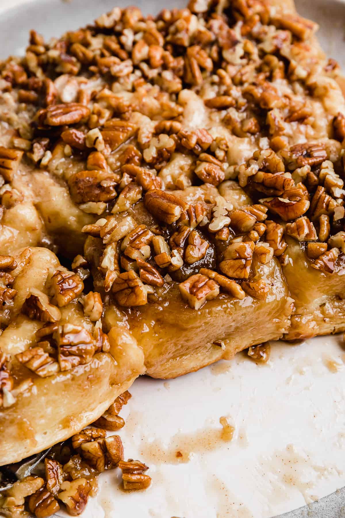 Pecan Sticky Buns on a white plate.