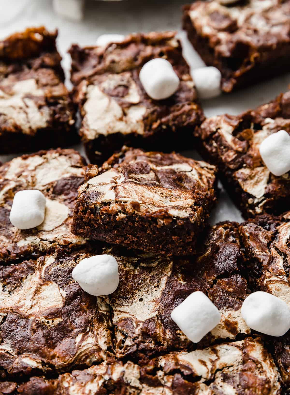 A made from scratch brownie recipe with marshmallows in the batter and marshmallow cream swirled into the top and baked.