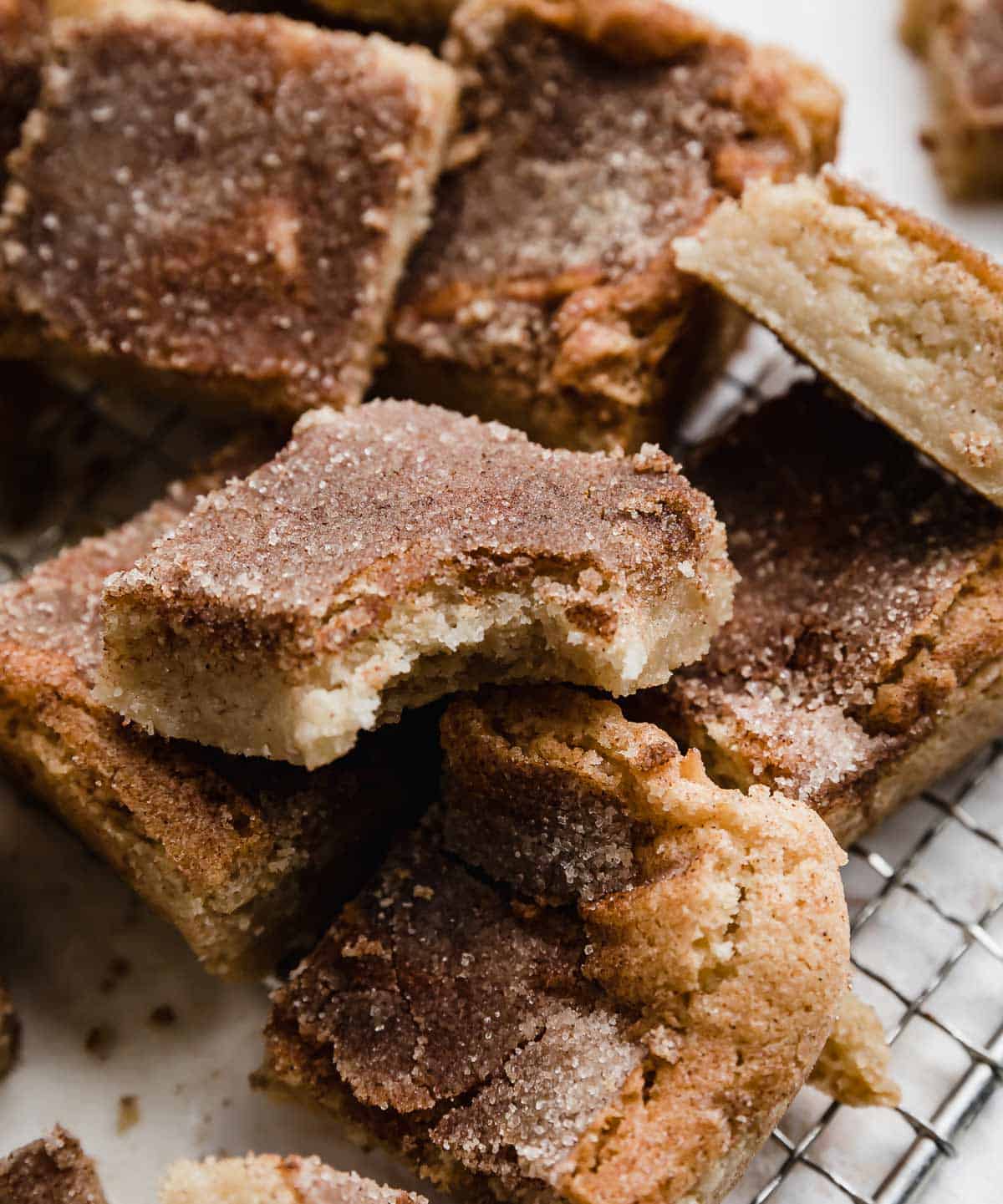 A Snickerdoodle Bar with a bite taken out of it.