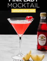 A Pink Lady Cocktail recipe without alcohol; a pink drink in a martini glass against a black background with the words, "Pink Lady Mocktail" written in white text above the photo.