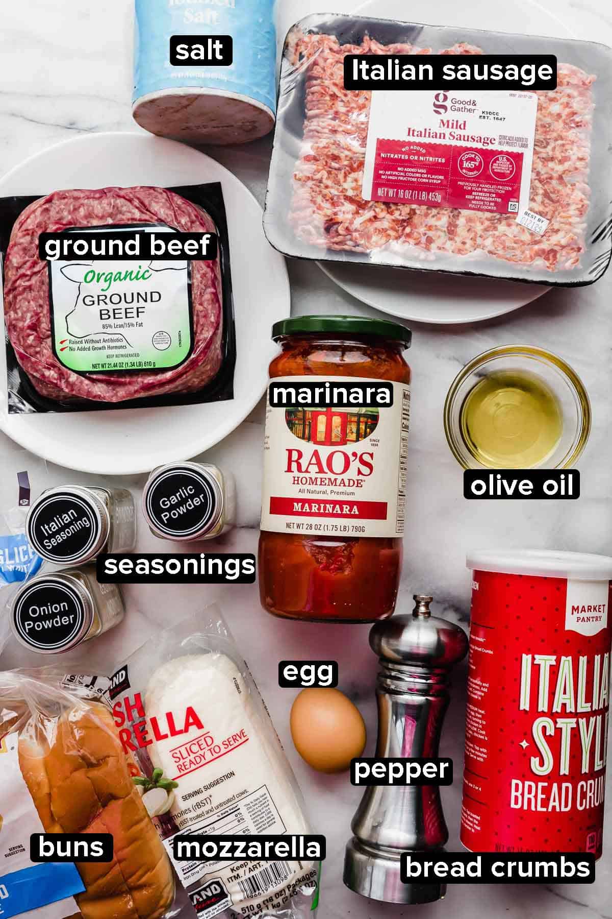 Italian Meatball Subs ingredients on a white background: ground beef, Italian sausage, marinara, bread crumbs, seasonings, egg, and mozzarella.