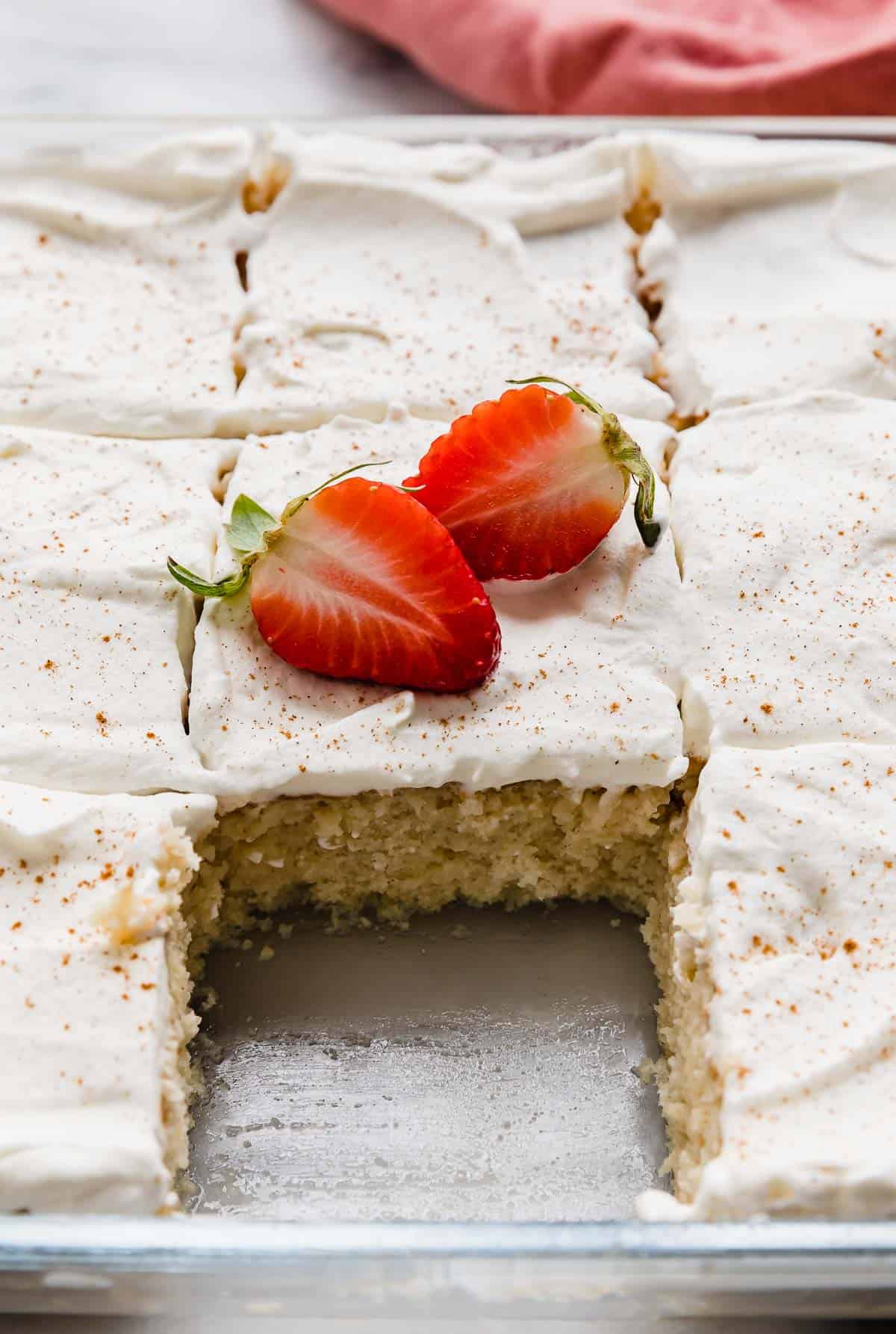The best Mexican tres leches cake topped with fresh strawberries.