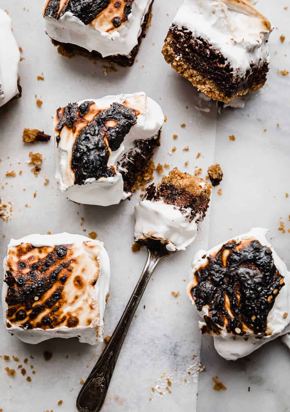 The best S'mores Brownies recipe from scratch cut into squares, with a fork cutting into the S'mores Brownie.