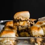 Breakfast Slider on a metal spatula against a black background.