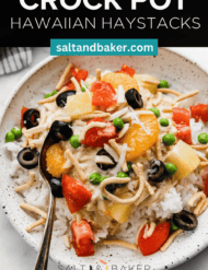 Easy Hawaiian Haystacks recipe on a white plate with tomatoes, olives, coconut, and green peas overtop of the creamy chicken mixture and rice, with the words, "Crock Pot Hawaiian Haystacks" written in white text above the photo.