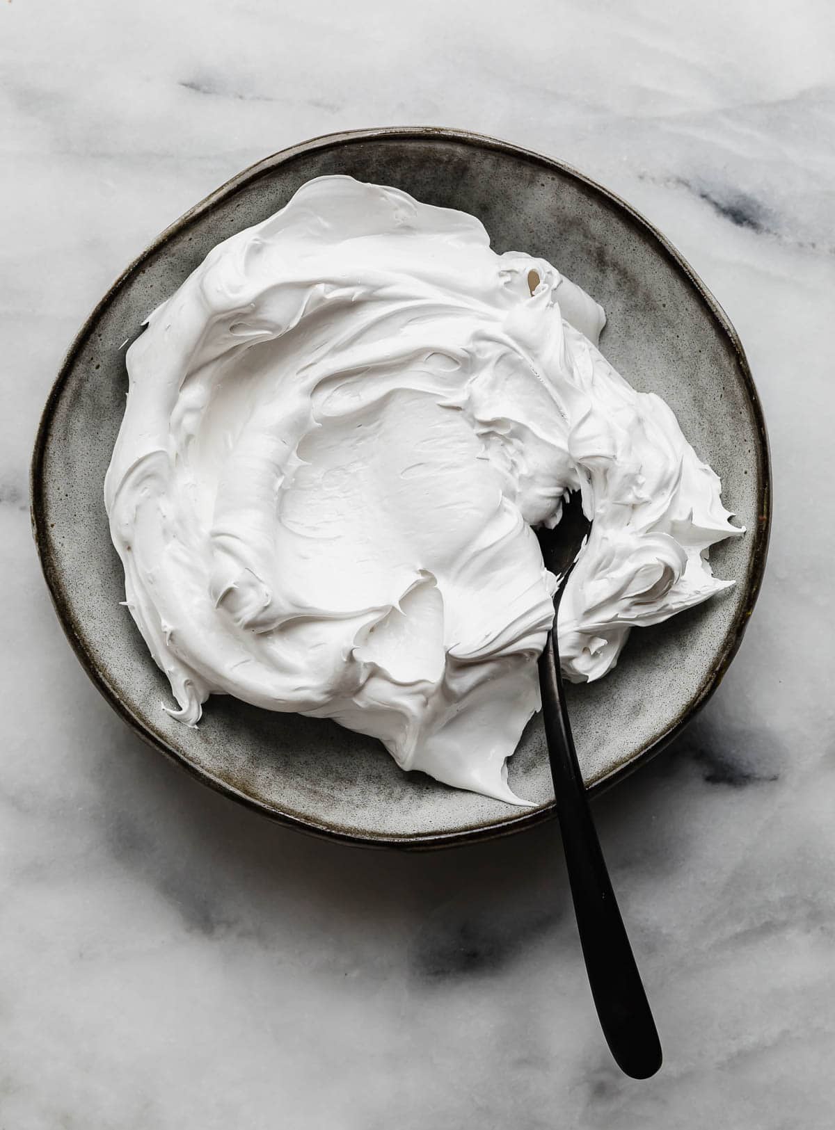 The best Homemade Marshmallow Cream recipe (creme) on a gray plate.