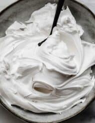 the best Homemade Marshmallow Cream recipe swirled on a gray plate.