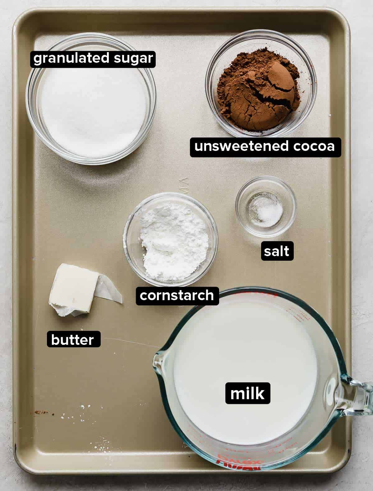 Ingredients used to make a homemade chocolate pudding for a chocolate pudding poke cake.