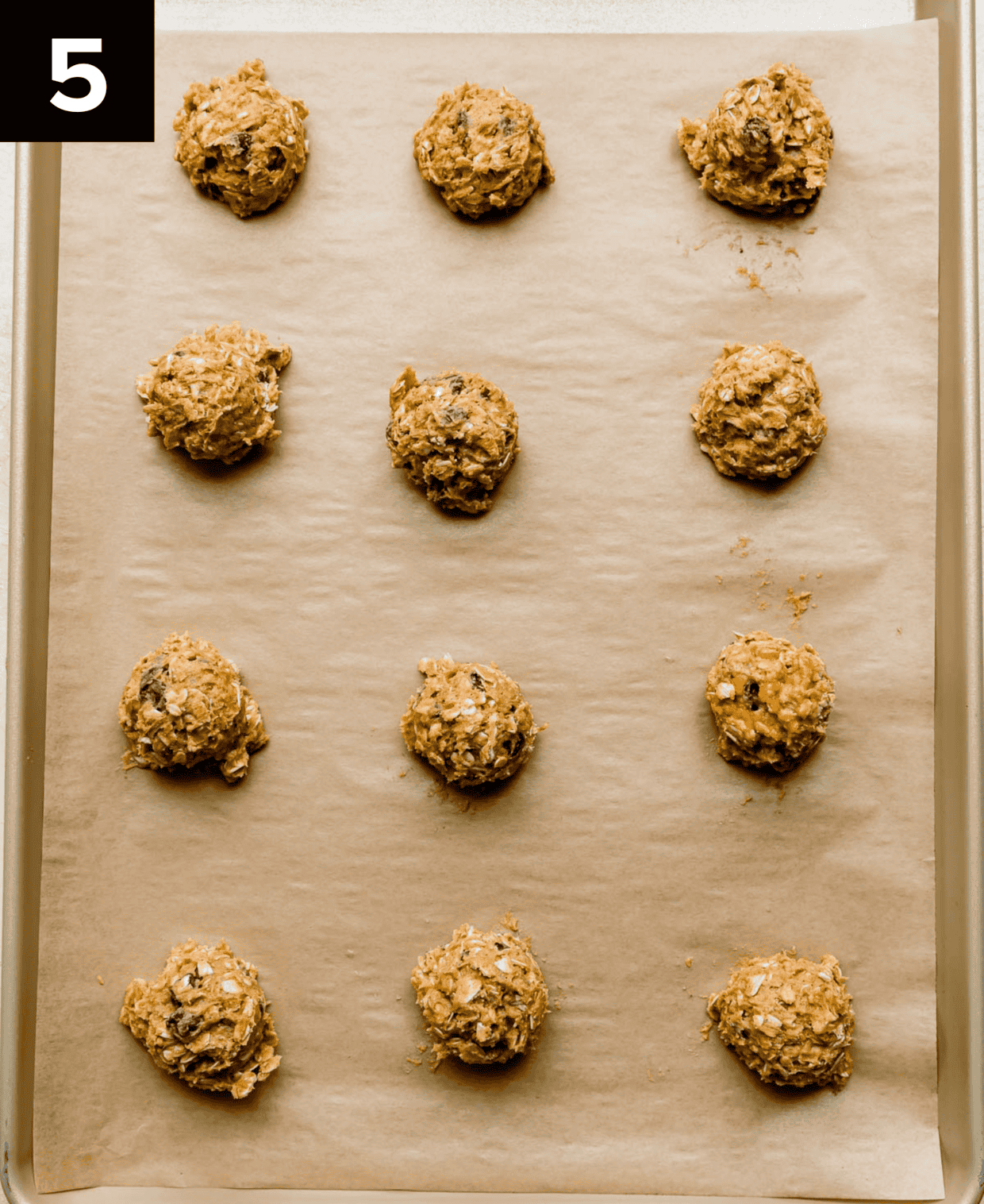 Chocolate Chip Oatmeal Pumpkin Cookie dough balls on a baking sheet.