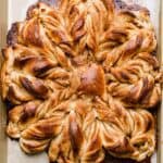 Golden baked Cinnamon Roll Snowflake Bread.