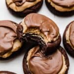 A Buckeye brownie Cookie with a bite taken out of it.
