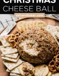 A pecan covered Cheese Ball with the words, "Christmas Cheese Ball" written in white text above the photo.