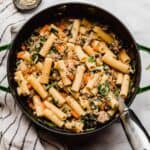 Carrot, onion, celery, and spinach loaded Italian Sausage Rigatoni in a large pot.