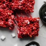 A Red Velvet Rice Krispie treat on a light gray background.
