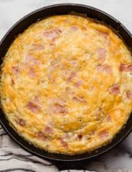 Ham and Cheese Frittata recipe in a cast iron skillet.