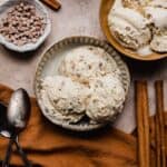 Three scoops of cinnamon spice ice cream in a bowl.