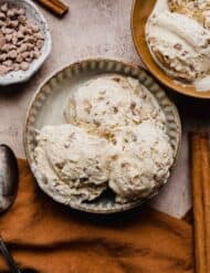 Three scoops of cinnamon spice ice cream in a bowl.