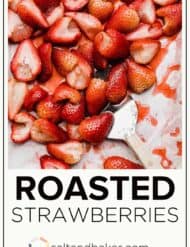 Baked Strawberries on a baking sheet with the words, "roasted strawberries" written in black font below the photo.