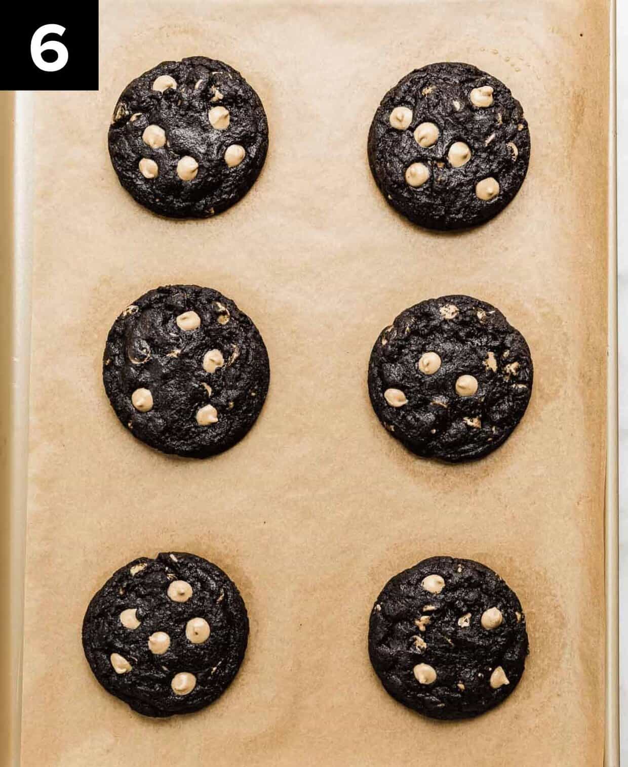 Six easy oreo peanut butter cookies (6) on a Kraft lined baking sheet.