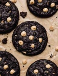 Overhead photo of Peanut Butter Oreo Cookies studded with peanut butter chips on a Kraft parchment paper.